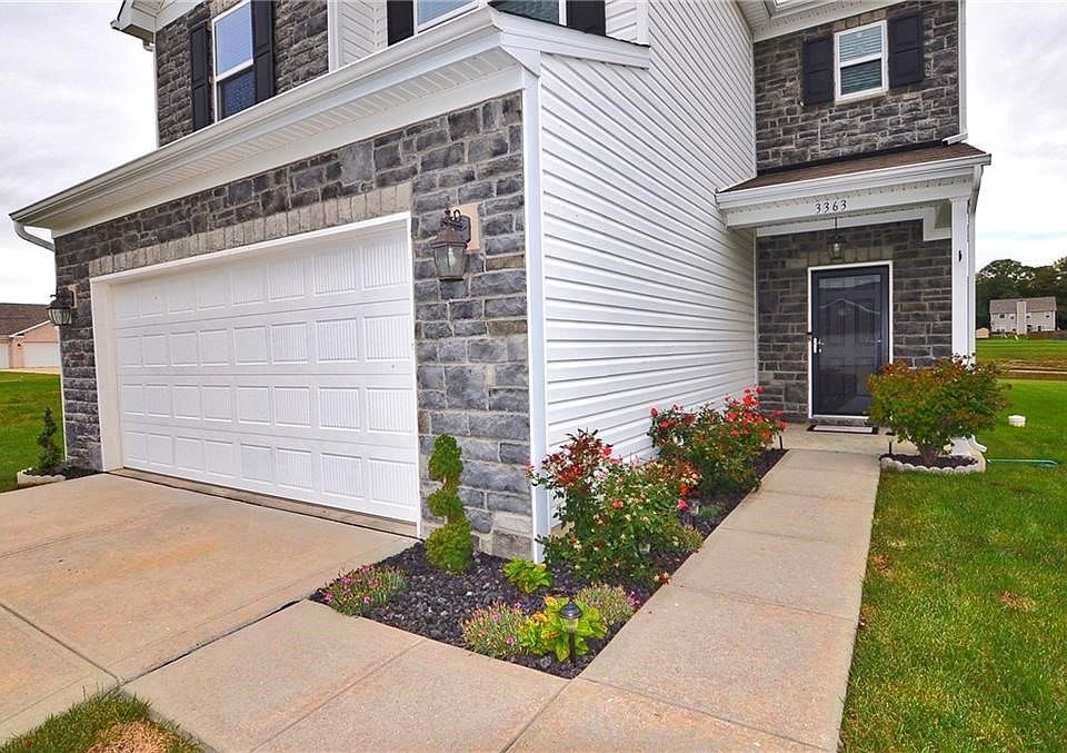 Brand new landscaping highlights the entrance to this lovely home.