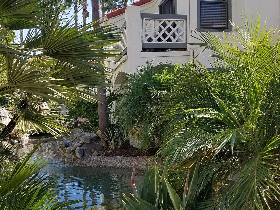 quiet upstairs unit is above small pond & waterfall. complex has tropical landscaping throughout