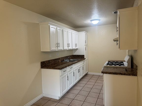 Kitchen has lots of cabinets, so a lot of storage.