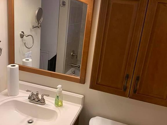 small bathroom with washer/dryer area