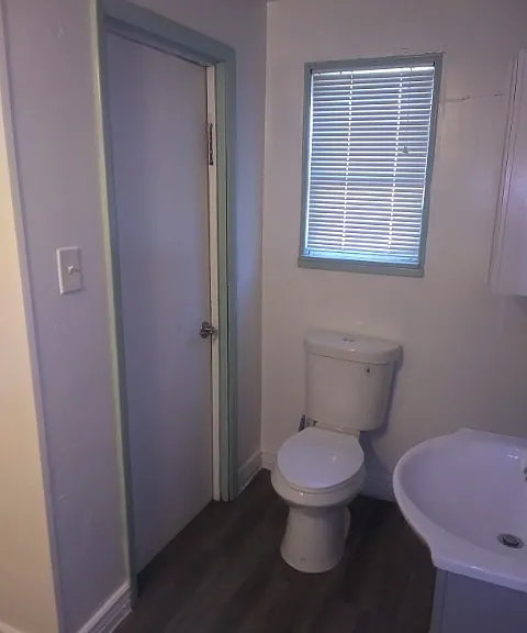 lockable bathroom with door leading to back mud room