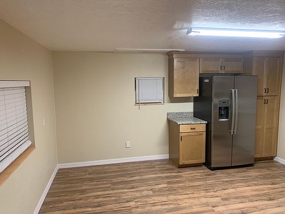 Large kitchen with new side by side refrigerator