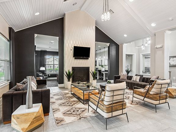 Modern Clubhouse with TVs, Kitchen & Coffee Bar at Katy Ranch Apartments in Katy, TX