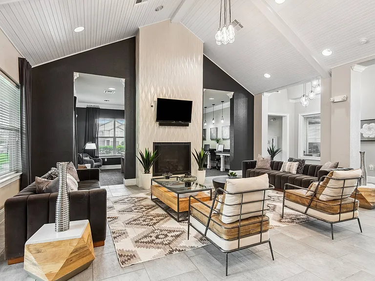 Modern Clubhouse with TVs, Kitchen & Coffee Bar at Katy Ranch Apartments in Katy, TX