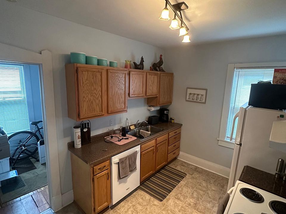 Kitchen with new dishwasher. Room on left is the small bonus room/ office office.