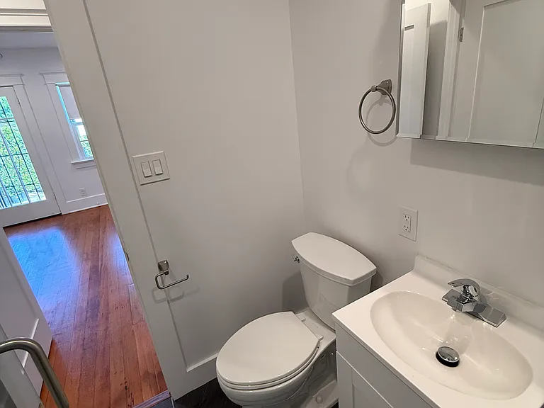 View of Bathroom facing towards Laundry closet and Living Area