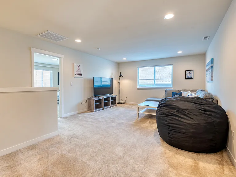 Spacious Upstairs living room. Perfect for movie nights!