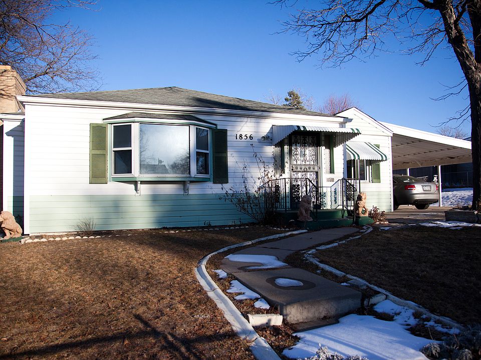 House w/ Carport to right