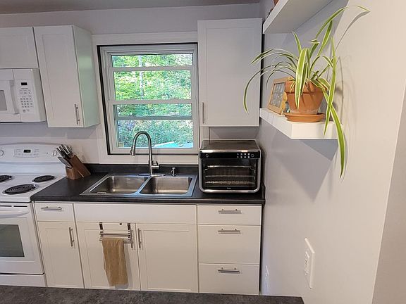 Microwave, electric oven, dishwasher, refrigerator included. Toaster oven not included.