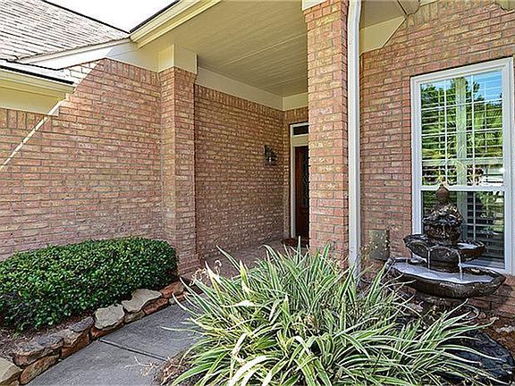 The covered entry is accented with a beautiful fountain.