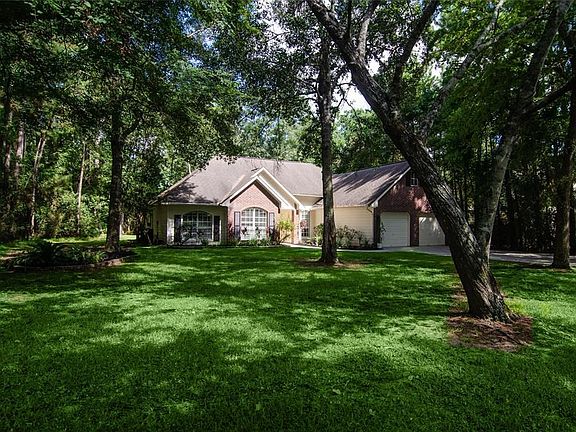 Nestled on an oversized, cul-de-sac lot, this elegant Country Manor affords complete, privacy amidst a woodland backdrop, offering the amiability of an established and prestigious, Woodlands neighborhood, and is an immaculate custom built gem, with amazing curb appeal.