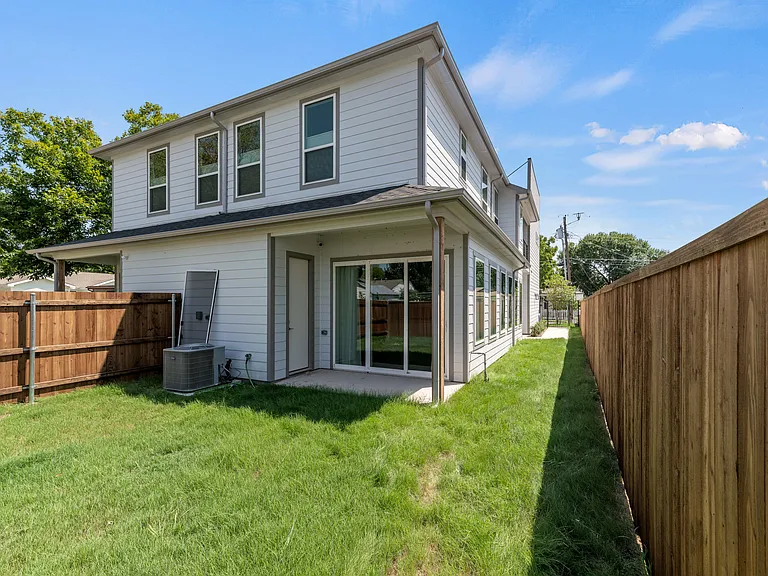Backyard has plenty of room for kids, pets, and entertaining. An 8' x 5' storage room is accessed off the back patio.