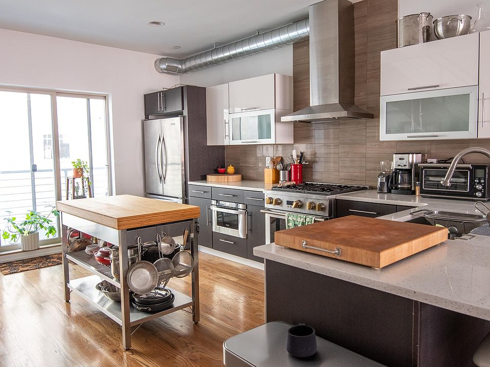 Kitchen with Monogram Gas Range and Oven