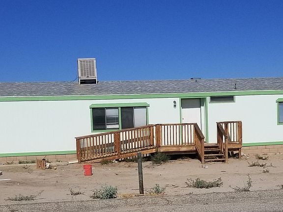 Freshly painted outside. Manufactured home on permanent foundation with periodic upgrades since 2007. Sidewalk from driveway to wheelchair ramp up to porch. Porch recently repaired and stained.