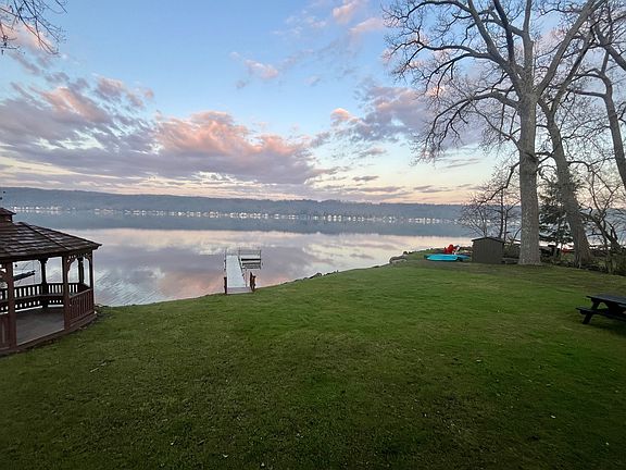 Lakefront, including multiple kayaks and gazebo.