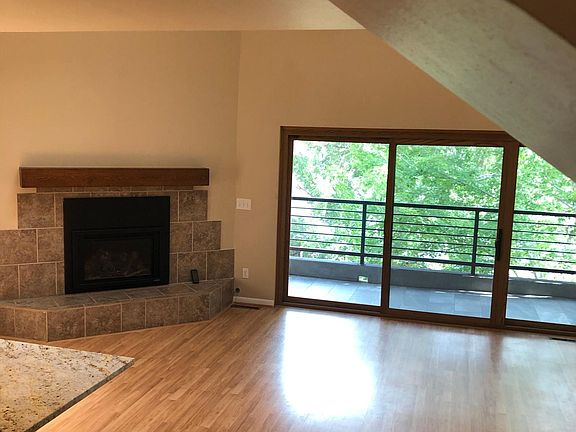 Large living room 17.6' x 13.9'; vaulted ceiling; new gas fireplace insert; skylights; laminate flooring; new sliding patio door with argon filled glass reduces heat from solar gain; tiled balcony with gorgeous lake and mountain views