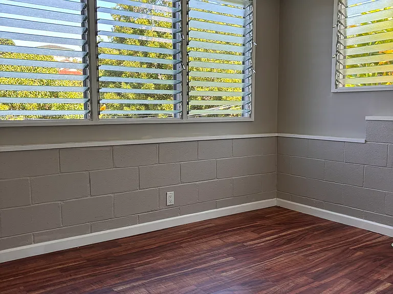 Bedroom has ceiling fan and window AC