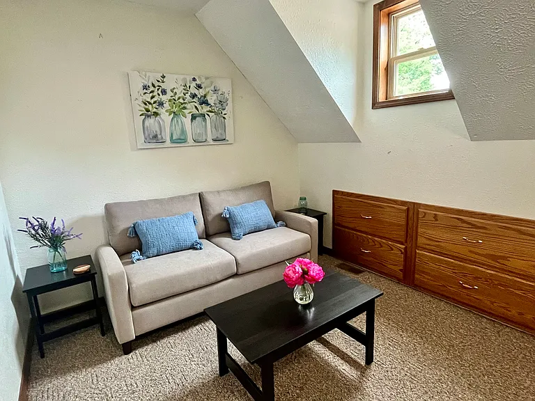 Living room sitting area with built in drawers