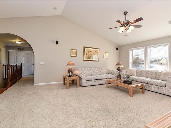 Vaulted great room with windows that have waterview! Arched openings, whole house audio, neutral decor and paint!