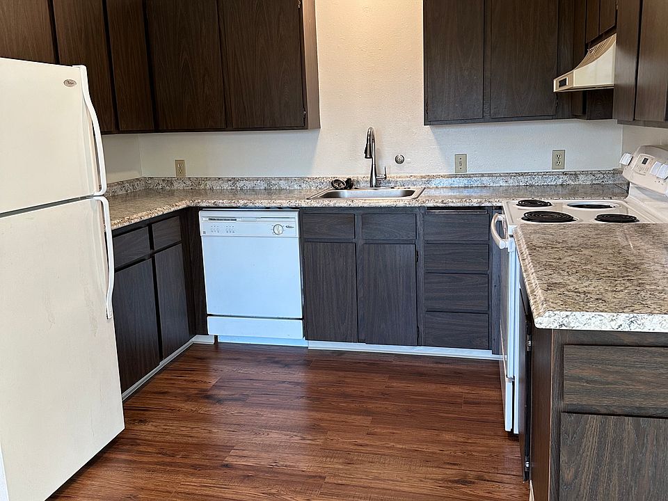 Large kitchen with dishwasher, updated with granite counters and wood floor.