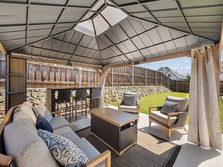 Beautiful large gazebo for backyard entertaining and relaxation! Outdoor patio furniture not included in furnishings.