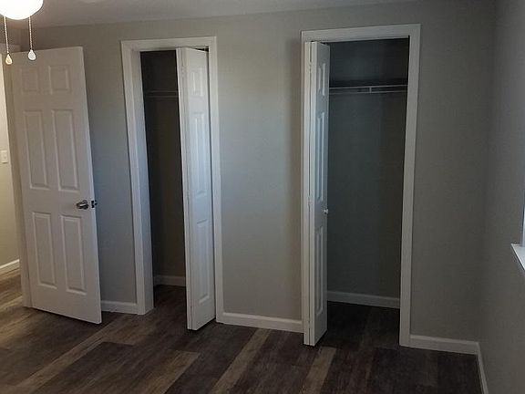 Bedroom #1 of 2, two closets in each bedroom. Ceiling fan/light in bedroom.