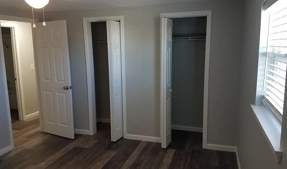 Bedroom #1 of 2, two closets in each bedroom. Ceiling fan/light in bedroom.