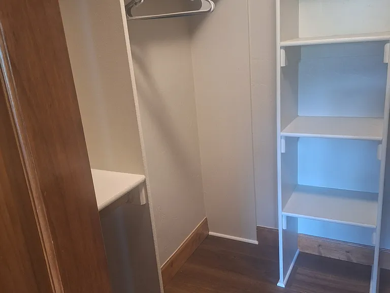 Rear master bedroom walk in closet.