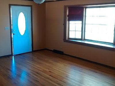 Main living room, front door, hardwood floors, Pella wood bay window