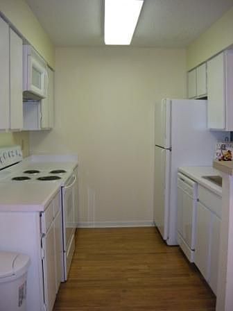 Kitchen has recent appliances and stainless sink