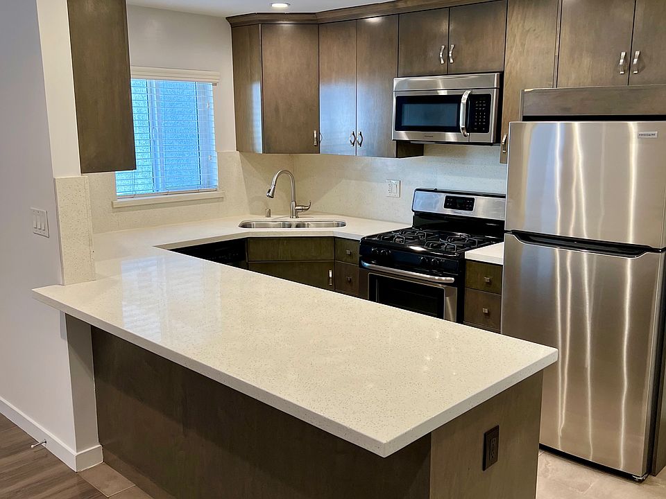 Modern Kitchen with Quartz Counters and Custom Cabinets