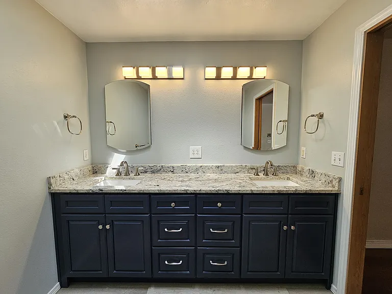 Quartz counters with dual undermount sinks and a skylight!