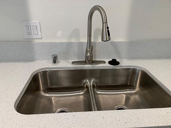 New stainless steel sink and faucet