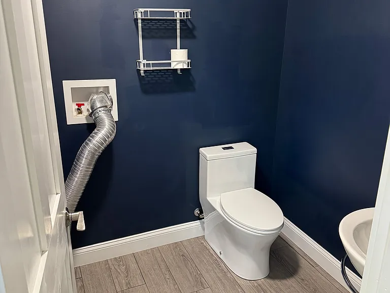 Downstairs half bath, includes washer and dryer hook ups.
