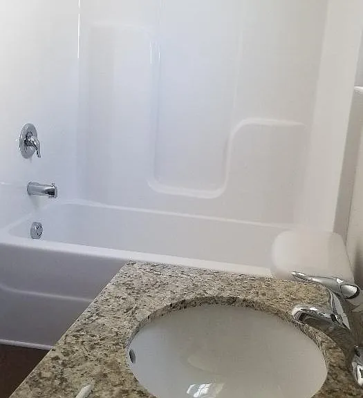 Double Vanity with Granite countertops . Tub Shower combo in second Bathroom
