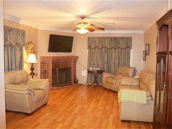 Family room with hard wood floors.