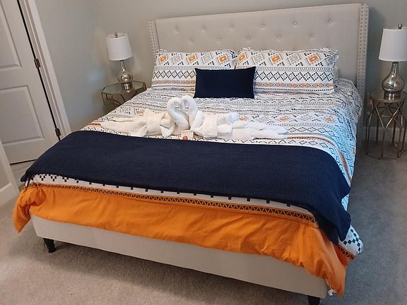 Primary bedroom with ensuite bathroom and walk in closet.