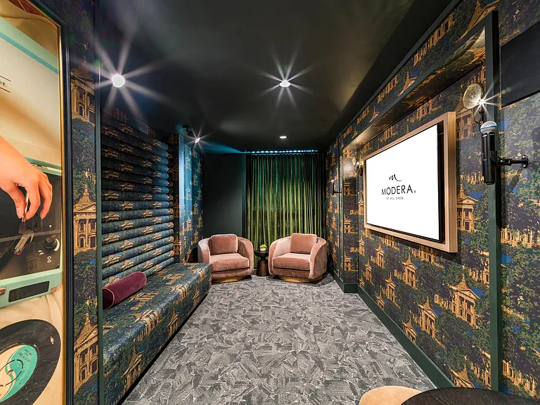 Sing, stream, or unwind in the karaoke lounge at Modera St. Paul, a vibrant space to enjoy music and entertainment in downtown Dallas.