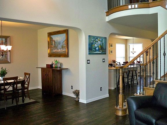 View of Formal Dining Room and Open Kitchen from the Front Formal