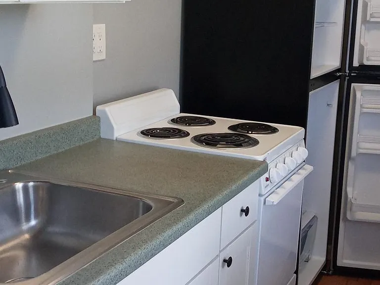 Newer galley kitchen appliances and faucet