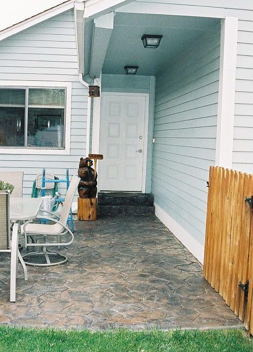 Front entry with custom concrete patio