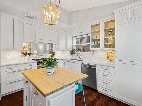 Fully stocked kitchen with island bar