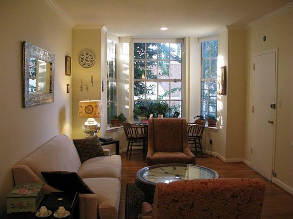 The living room is flooded with natural light and is large enough for entertaining.