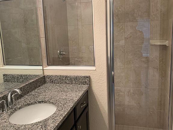 Primary bathroom with granite countertops