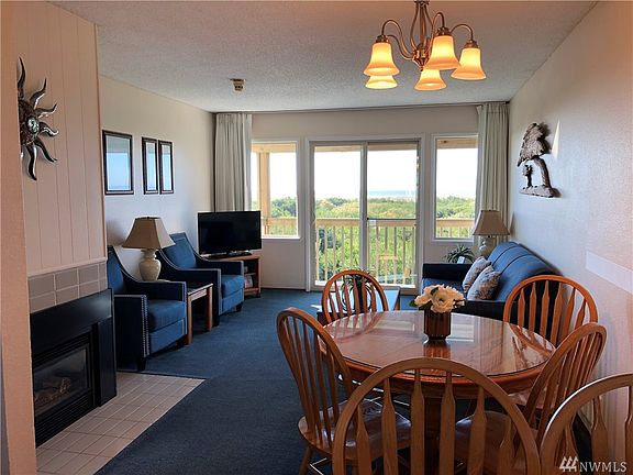 Open concept living and dining area with a spectacular view of the Ocean. 
