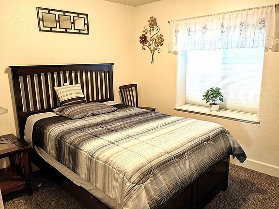 Bedroom B3. Fully furnished with a full-size bed.