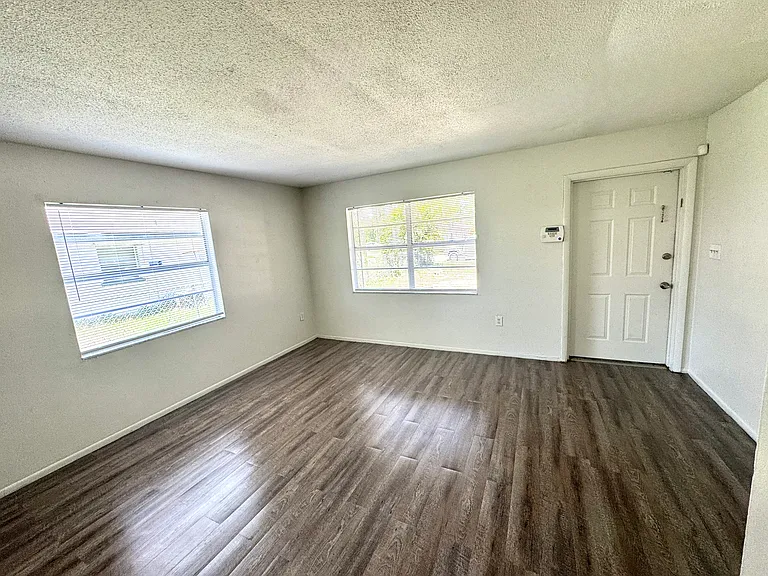 Interior photos are of a neighboring unit with identical floor plan. Paint color is the same, but the flooring is actually ceramic tile.