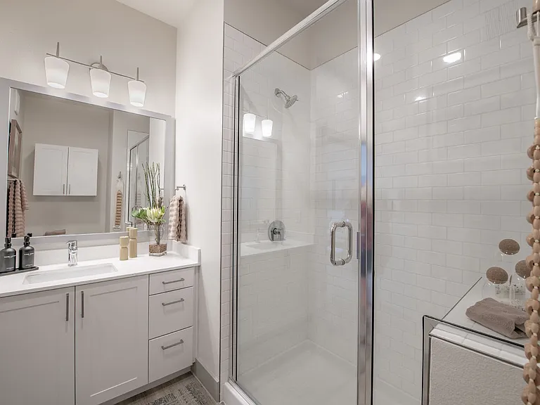 Elevate your lifestyle at Sage at Celina Residences with our modern bathrooms, featuring sleek designs and spacious walk-in showers. Enjoy a blend of style and comfort in every detail. Take the next step and schedule your tour today!
