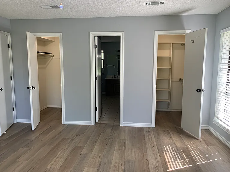 His & Hers Closets- Primary Bedroom