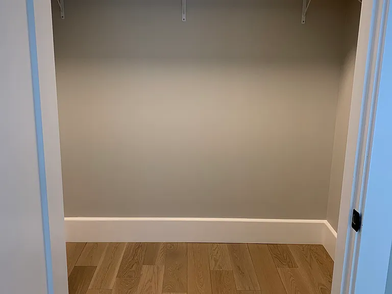 Primary bedroom walk in closet